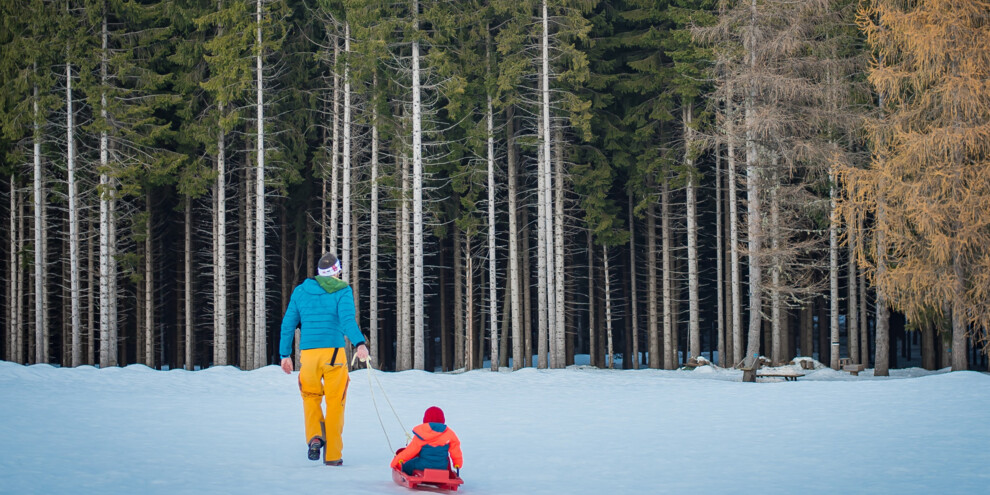 Papà con bambino nella neve - Bob | © Galvagni